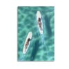 Aerial view canvas art showing two surfers on white surfboards in crystal-clear turquoise ocean waters, perfect for coastal home decor and beach house styling.