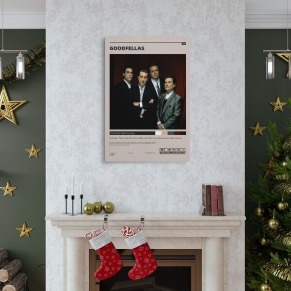 Goodfellas movie poster displayed above fireplace in elegant Christmas living room with green walls and holiday decorations.c