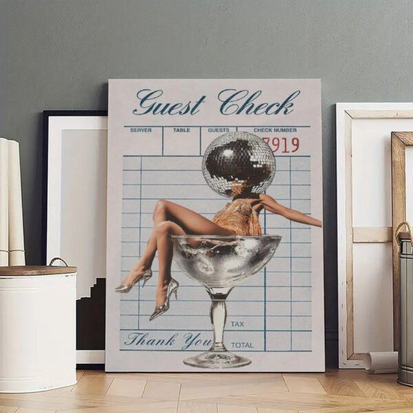 Unframed "Guest Check" disco ball martini art print displayed in minimalist Scandinavian-style interior with neutral decor and empty picture frames on hardwood floor.