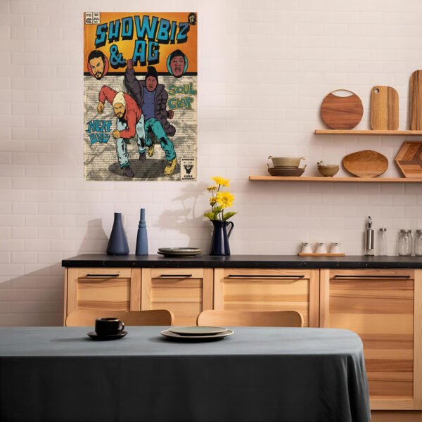Showbiz & AG vintage comic poster displayed in modern Scandinavian kitchen with wood cabinets, black countertops, and ceramic dishware on floating shelves.