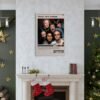 Holiday-decorated living room featuring That 70's Show poster above fireplace mantel with Christmas stockings, gold ornaments, and green accent walls creating festive home decor inspiration.