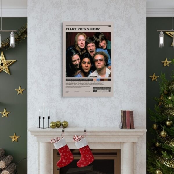 Holiday-decorated living room featuring That 70's Show poster above fireplace mantel with Christmas stockings, gold ornaments, and green accent walls creating festive home decor inspiration.