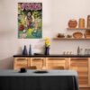 J Cole comic book poster displayed in modern Scandinavian kitchen with wood cabinets and floating shelves, demonstrating hip-hop wall art in culinary spaces.