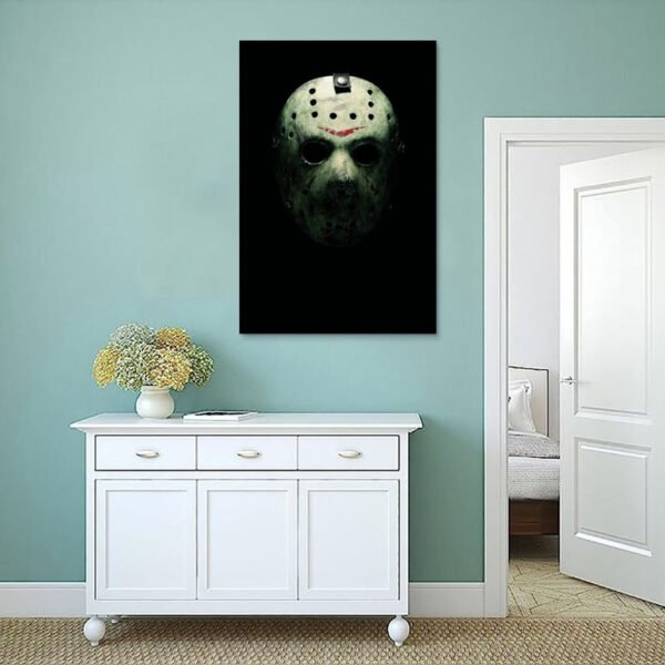 Jason Voorhees canvas wall art displayed on mint green wall above white cabinet in modern minimalist interior with dried flower decoration