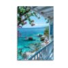 Mediterranean canvas wall art featuring Greek balcony with turquoise ocean view, bougainvillea flowers and white architecture
