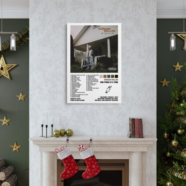 Morgan Wallen One Thing At A Time poster displayed above Christmas fireplace mantel in festive home decor setting.