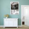 Morgan Wallen One Thing At A Time poster displayed on sage green bedroom wall above white sideboard in modern minimalist interior.