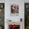The Big Lebowski movie poster displayed as wall art above fireplace in Christmas decorated living room, showcasing film memorabilia home decor ideas.