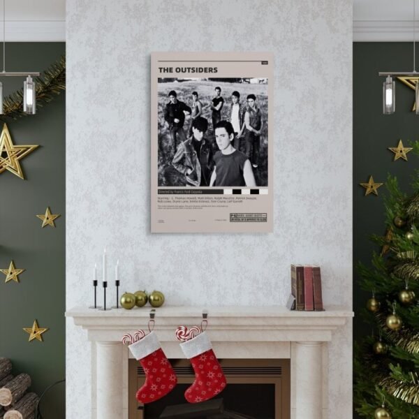 The Outsiders movie poster displayed above fireplace mantel in Christmas decorated living room with holiday decor