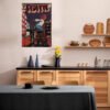 REDVEIL comic book poster displayed in modern Scandinavian kitchen with natural wood cabinets, black countertops, and minimalist design elements perfect for contemporary home decor.