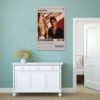 Scarface movie poster displayed on sage green wall above white vintage sideboard in minimalist coastal-style interior design.