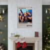 Shameless TV series poster displayed above white marble fireplace in elegant Christmas-decorated living room with gold star ornaments, evergreen garlands, and holiday stockings.