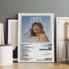 Framed Taylor Swift 1989 (Taylor's Version) album poster with complete 21-song track listing including vault tracks, displayed on wooden floor against concrete wall in modern interior.