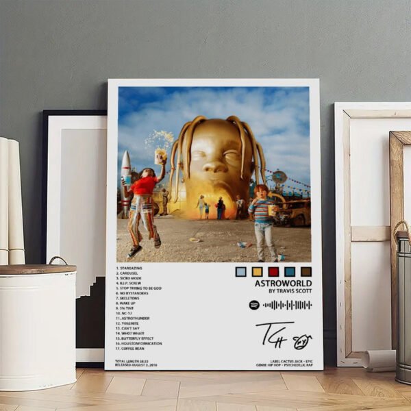 Travis Scott ASTROWORLD signed framed poster with complete 17-track listing including SICKO MODE and BUTTERFLY EFFECT, featuring golden head sculpture carnival artwork, 58:33 total length, released August 3 2018 on Cactus Jack/Epic Records, displayed in gallery setting with other framed artworks.