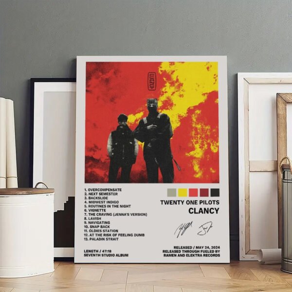 Twenty One Pilots Clancy album poster displayed in artist studio with framed artworks and creative workspace setting