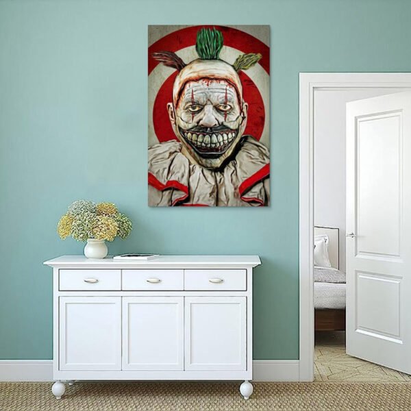 Twisty the Clown canvas wall art from American Horror Story displayed above white sideboard in minimalist mint green room