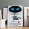 WALL-E Disney Pixar movie poster with blue-eyed robot character displayed in modern interior setting with framed artwork.