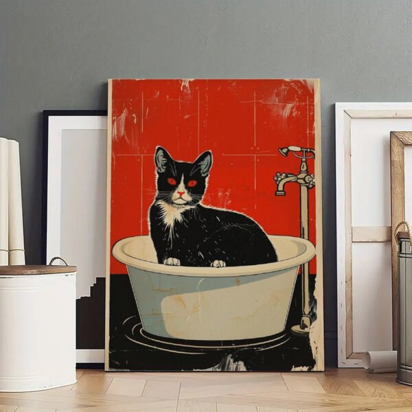 Woman styling a gallery wall by hanging vintage cat bathtub poster among curated art collection in modern home interior with eclectic decor.