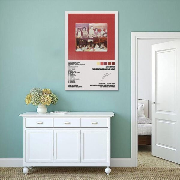 Zach Bryan The Great American Bar Scene poster displayed on sage green wall above white console cabinet in minimalist interior design